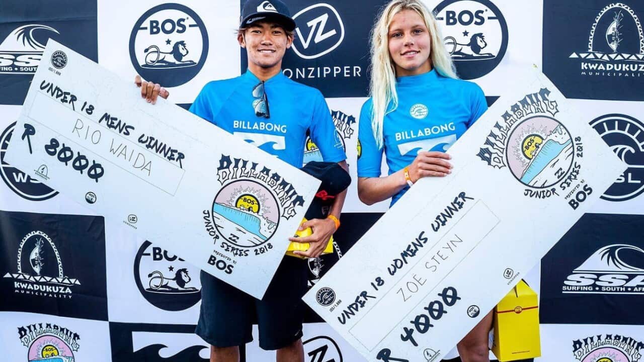 Rio Waida and Zoe Steyn with their winners cheques at the Ballito Pro in South Africa.
