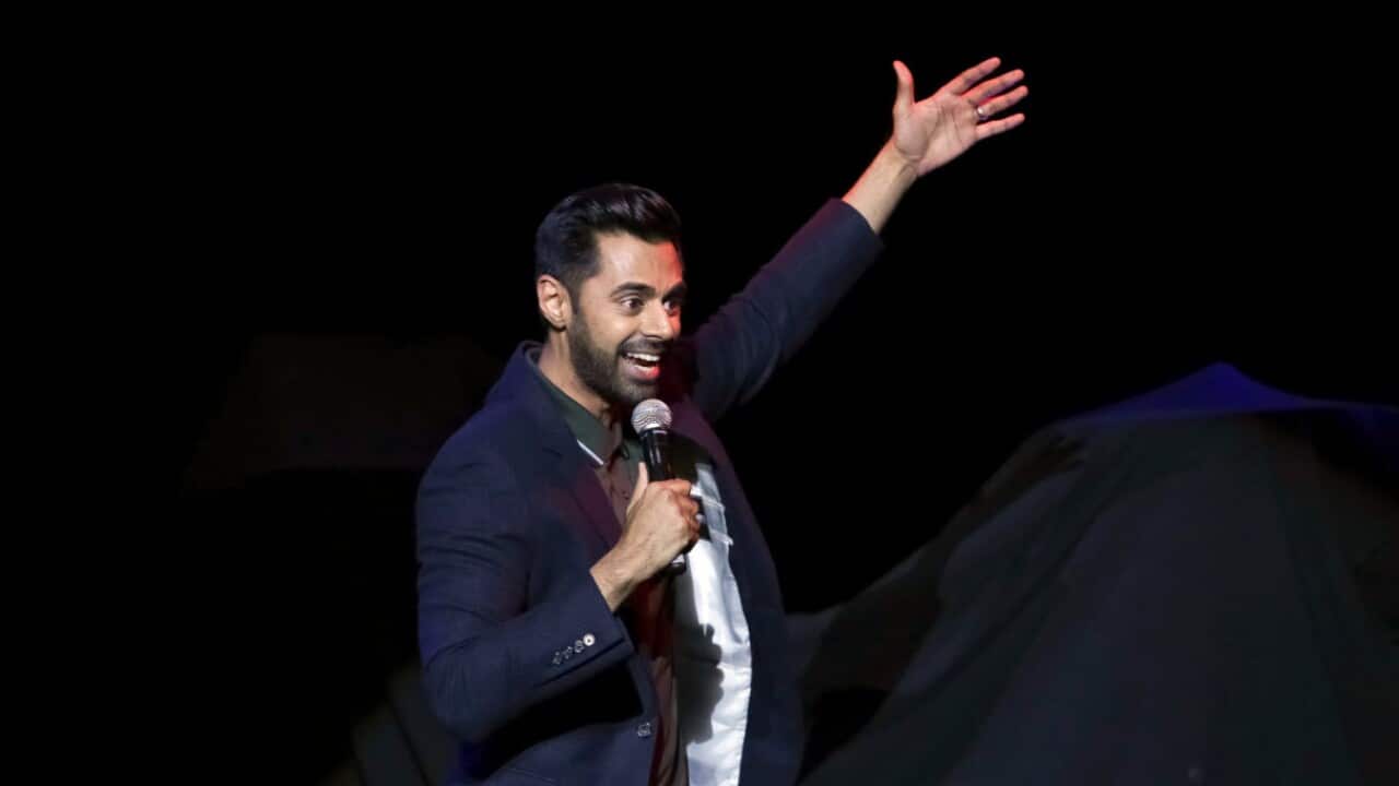 FILE- Comedian Hasan Minhaj performs on stage during the 11th Annual Stand Up for Heroes benefit