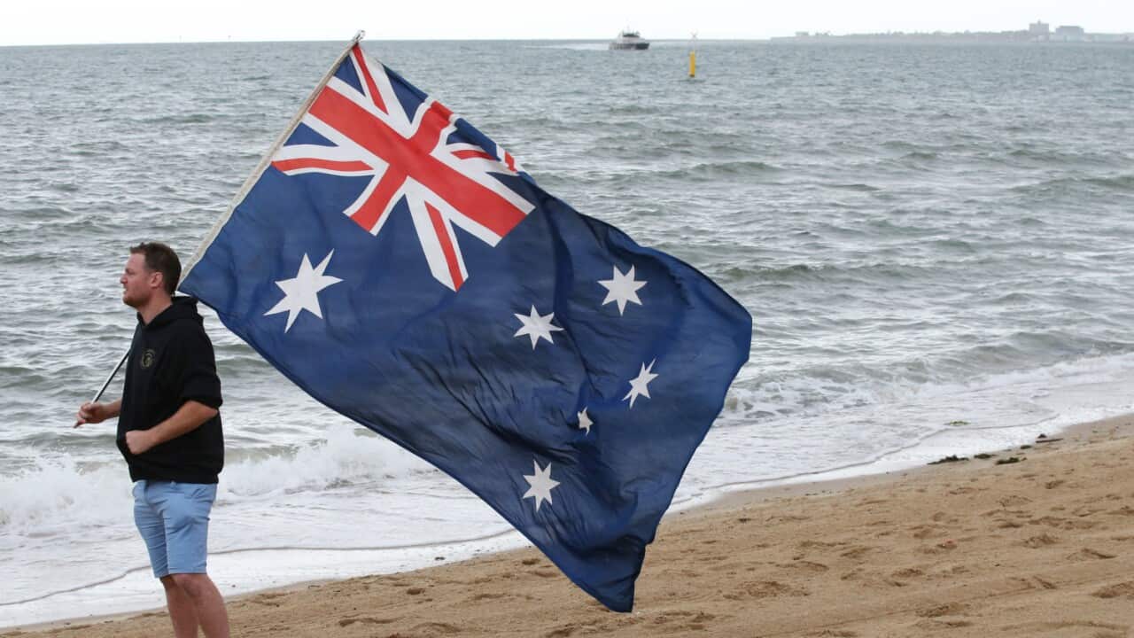 A right wing activist is seen on St Kilda beach