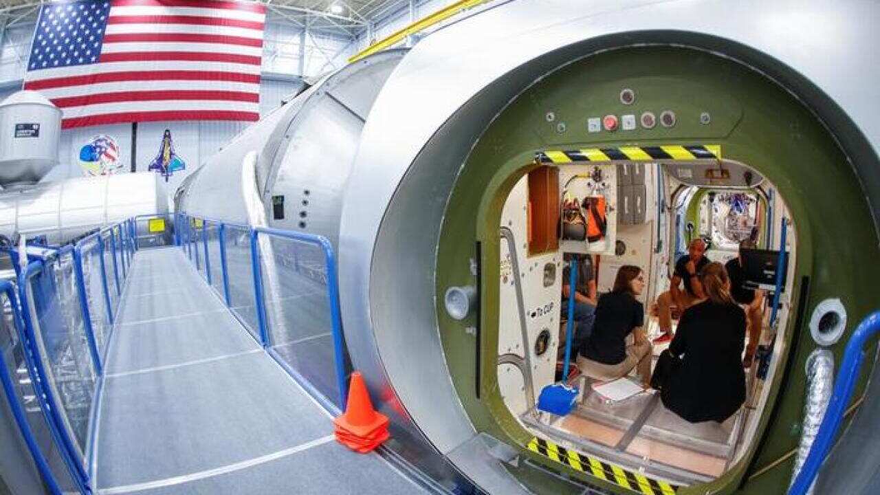 NASA commercial crew astronauts Michael Hopkins and Victor Glover run through a training session at a replica International Space Station (ISS) at the Johnson Space Center in Houston, Texas, May 22, 2019.