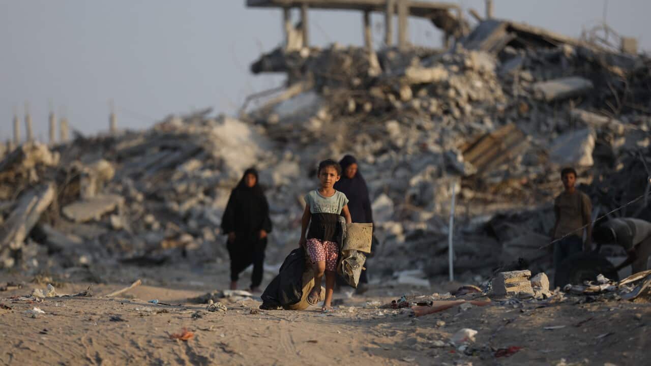 A child walking through the ruins of Gaza
