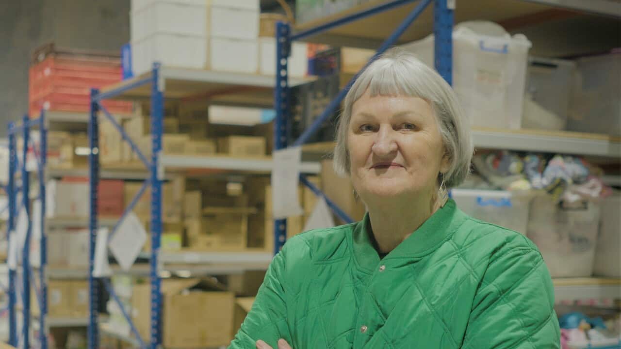 West Welcome Wagon CEO Colette McInerney standing in a green jacket.