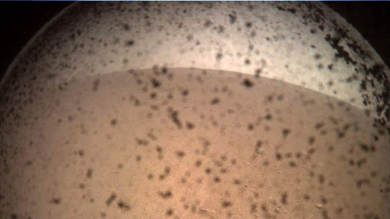 NASA's first image from the InSight lander after it touched down on Mars