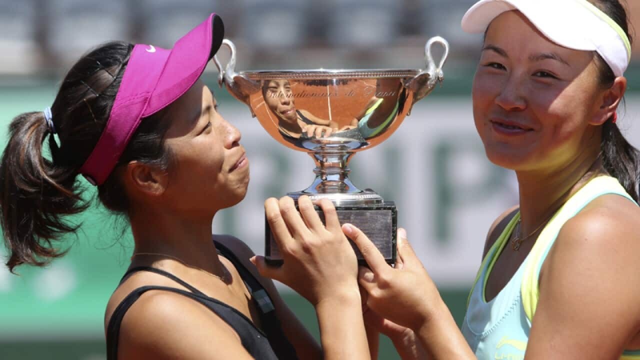 Su-Wei Hsieh and Peng Shuai hold their cup