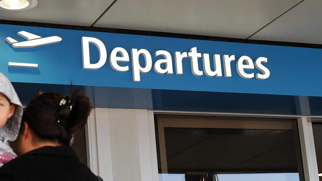File image of international travellers at Sydney International Airport, Sydney