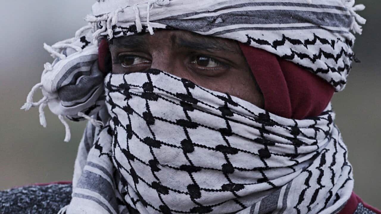 A Palestinian protester takes part during clashes with Israeli troops along the border between Israel and Gaza Strip, in the eastern Gaza Strip, 02 April 2018