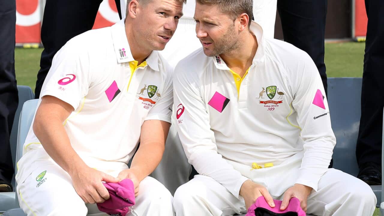 Australian cricketers Michael Clarke (R) and David Warner