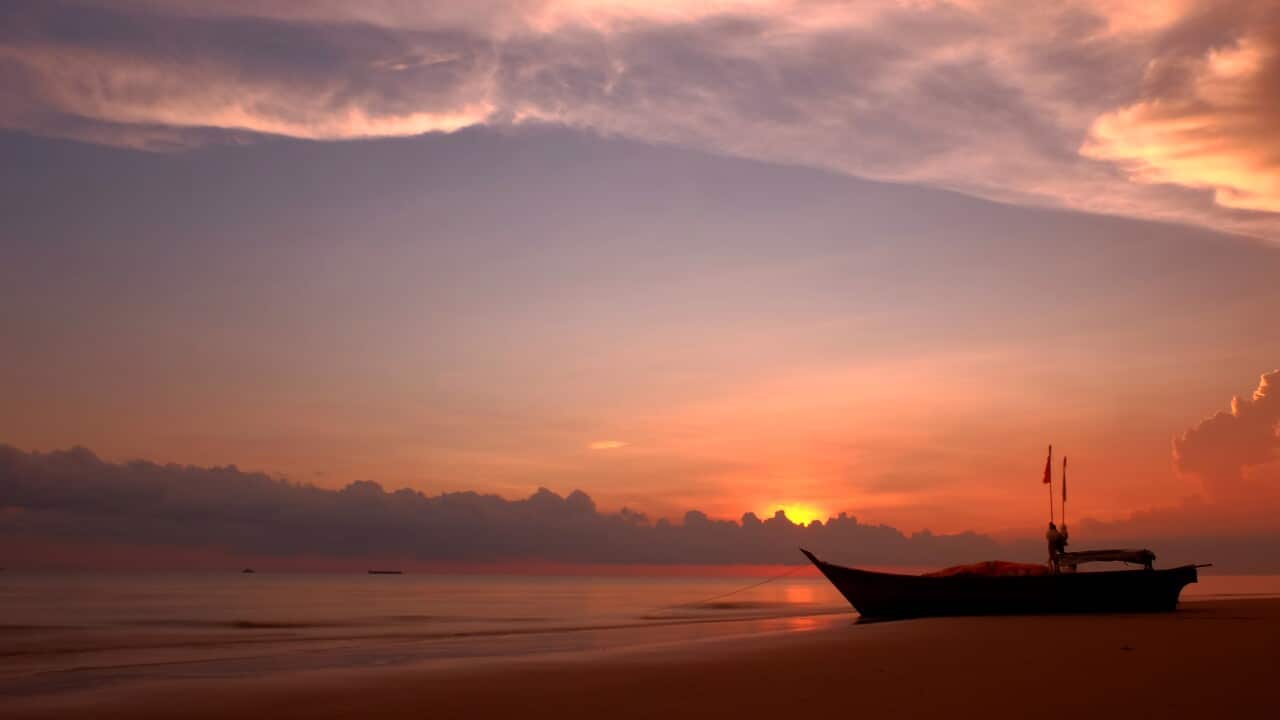 A fishing boat is seen docked on the coast of North Rupat Island.