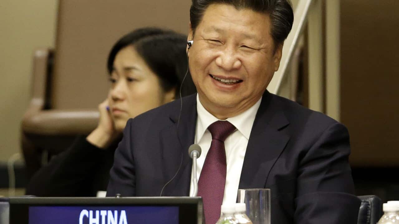 Chinese President Xi Jinping laughs during a meeting on gender equality and women's empowerment at United Nations headquarters, Sunday, Sept. 27, 2015. (AP Photo/Seth Wenig)