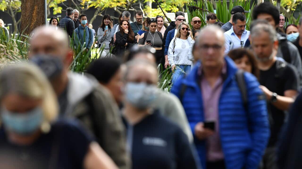 Members of the public wait for a vaccine at a mass COVID-19 vaccination hub in Sydney, Monday, May 24, 2021. (AAP Image/Joel Carrett) NO ARCHIVING