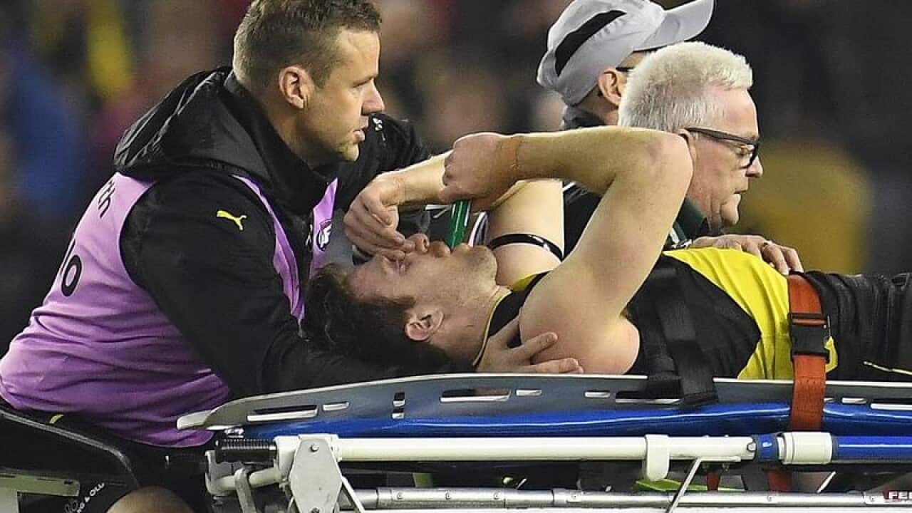 Reece Conca leaves the field after sustaining an injury