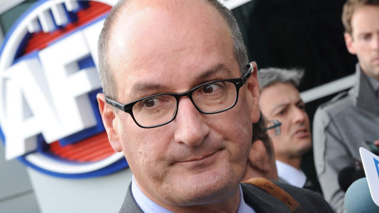 File photo of David Koch speaking to reporters