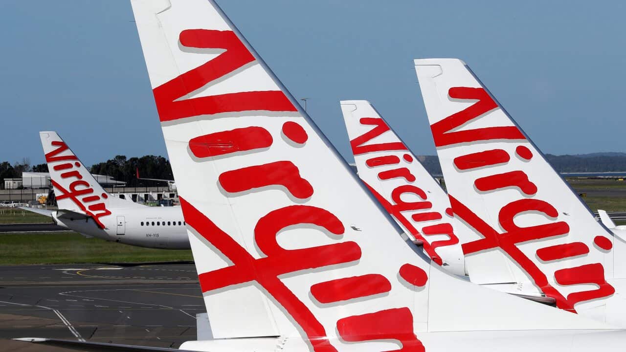 Virgin Australia planes are lined up at departure gates at Sydney Airport in Sydney.