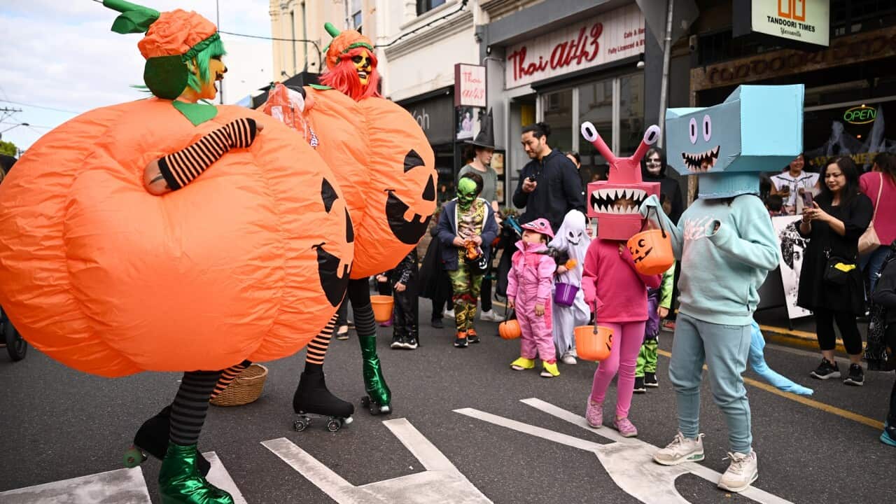 People wear costumes during Halloween celebrations at Yarraville Village in Melbourne (AAP)