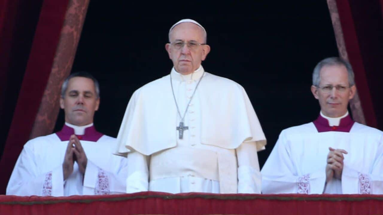 Pope Francis delivers his Christmas Urbi Et Orbi blessing from the central balcony of St. Peter's Basilica on December 25, 2017 in Vatican City.