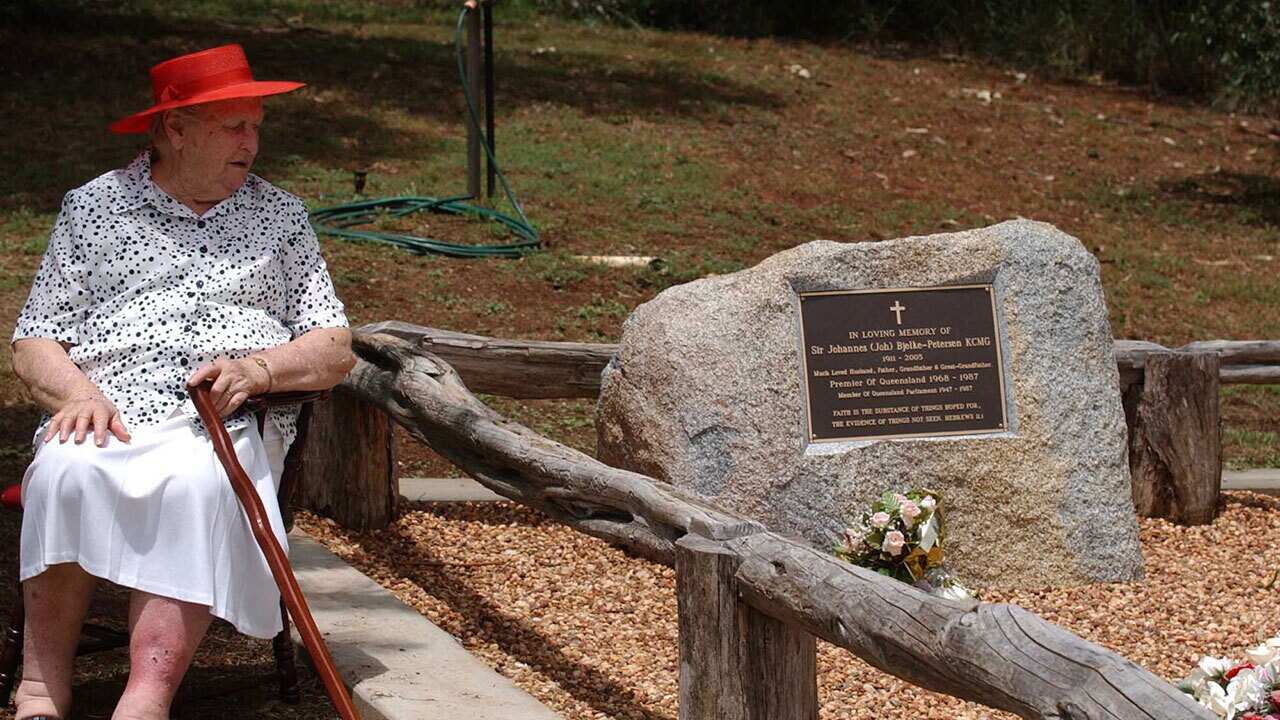 Lady Flo Bjelke-Petersen at the grave of Sir Joh Bjelke-Petersen on the family property Bethany at Kingaroy, north west of Brisbane, Monday, Feb. 6, 2006.