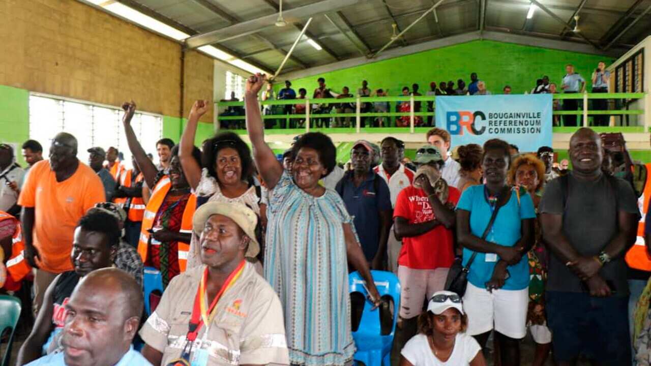 Members of the Bougainville Women's Federation cheer after results were announced