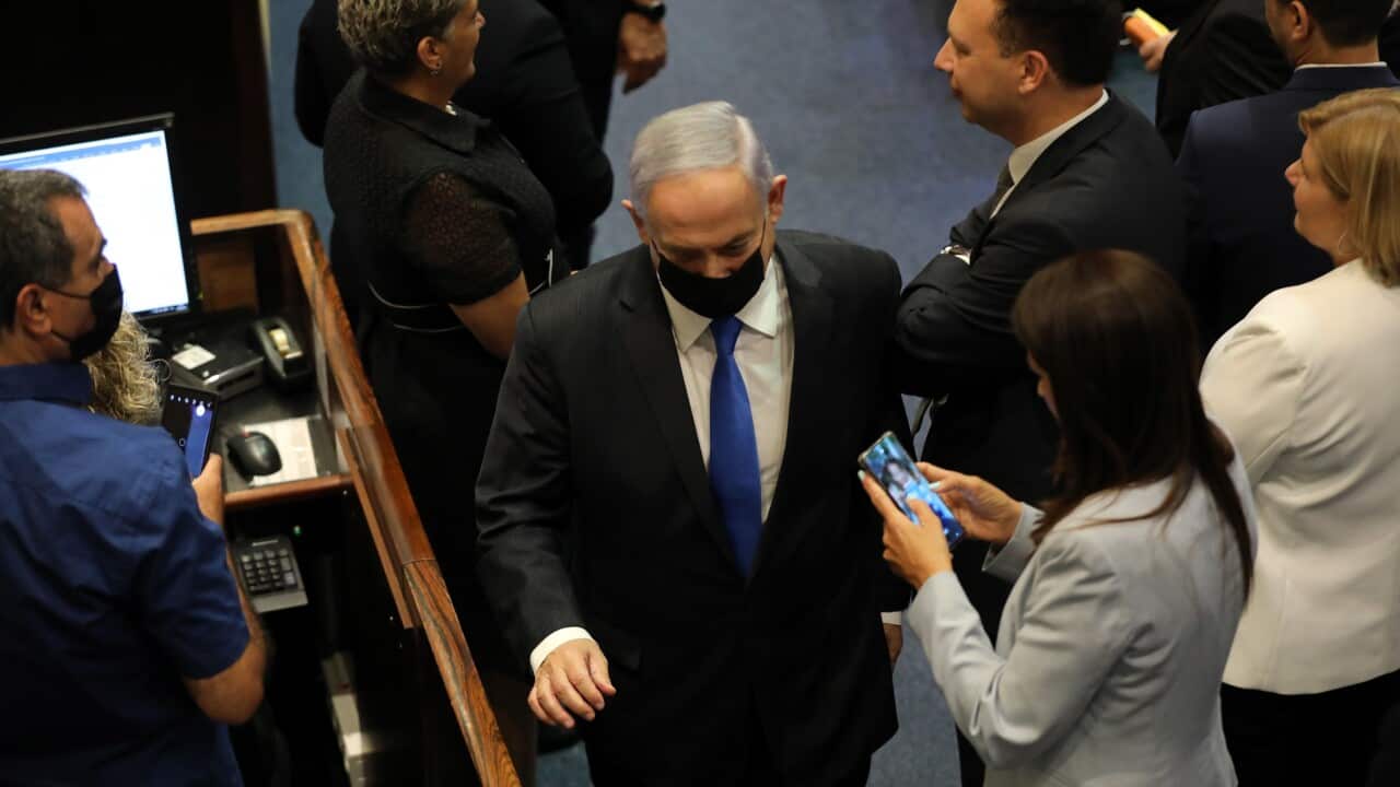 Benjamin Netanyahu leaves the Knesset after the results of a special voting session on the formation of a new coalition government on 13 June, 2021.