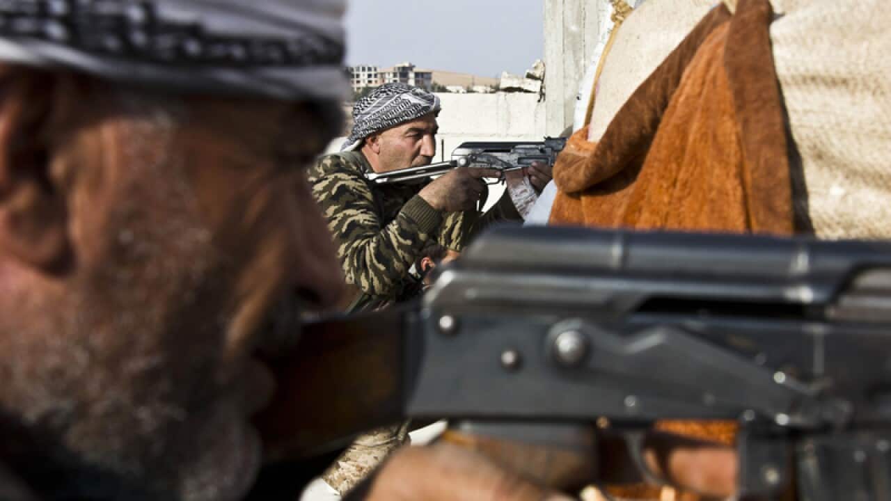 fighters from the Free Syrian Army & the Kurdish (YPG) fight IS