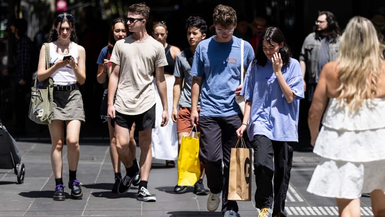 People walking along a street.