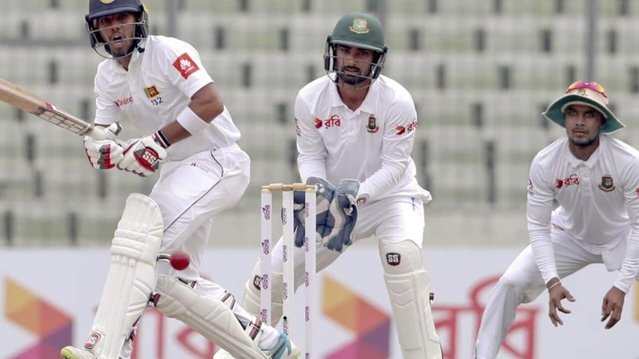 Sri Lankan batsman Kusal Mendis (L) plays a shot