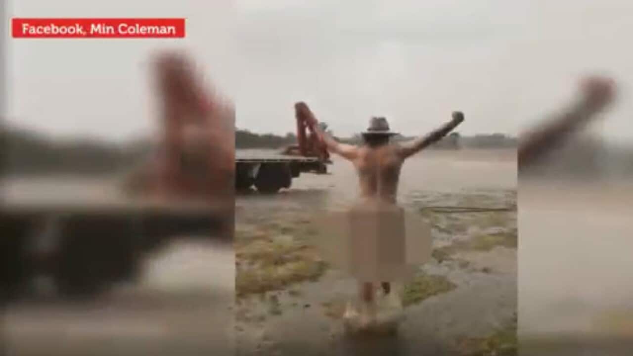 Naked dash: Drought-stricken NSW farmer celebrates rain