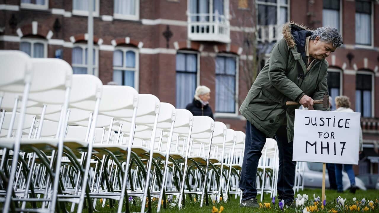 Relatives of victims of the Malaysia Airlines flight MH17 crash hold a silent protest in front of the Russian embassy in The Hague.
