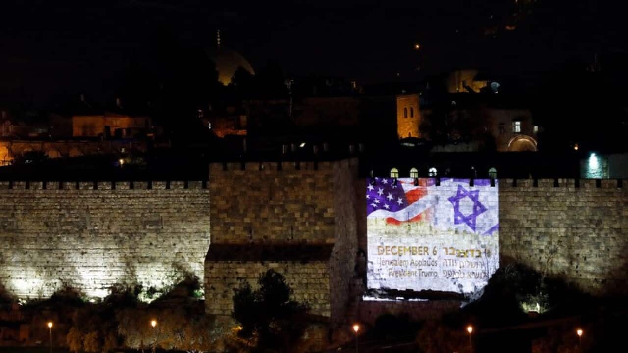 US and Israeli national flags in Jerusalem's Old City