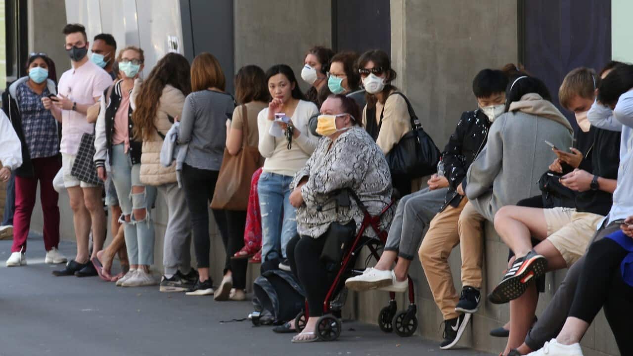 People line up outside the Royal Melbourne Hospital for coronavirus testing