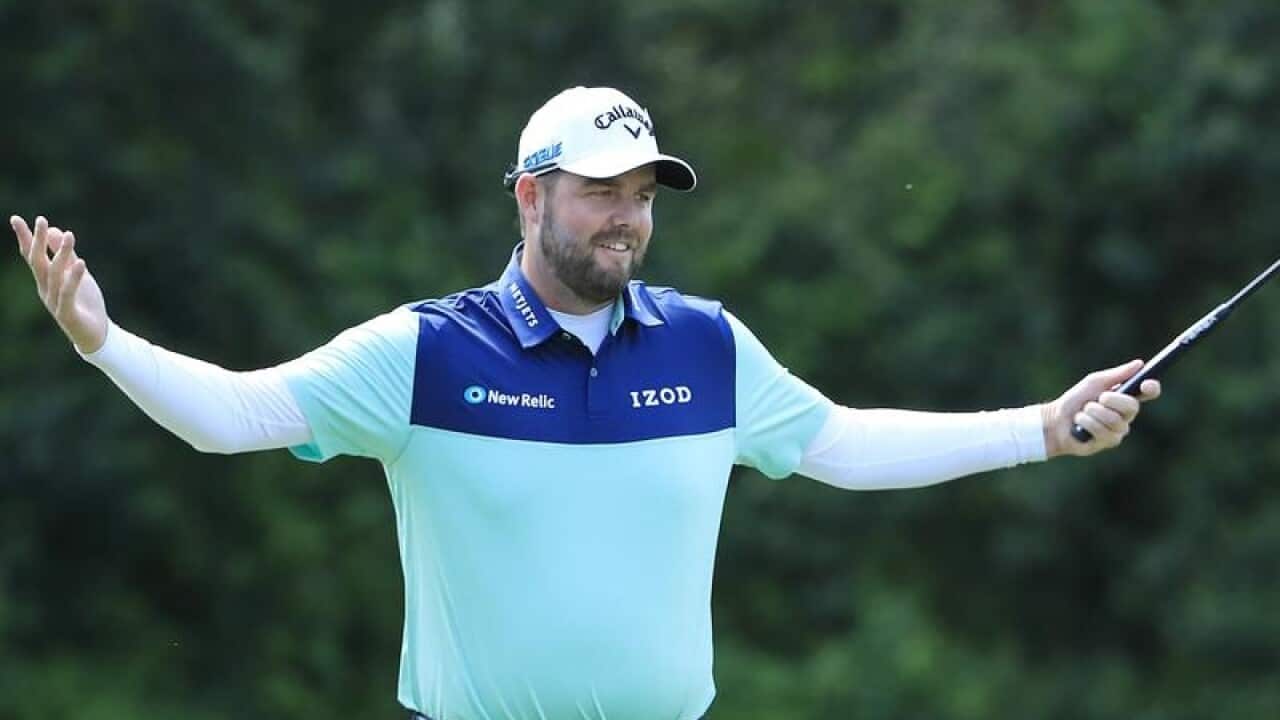 Marc Leishman of Australia reacts to his putt on the sixth hole.