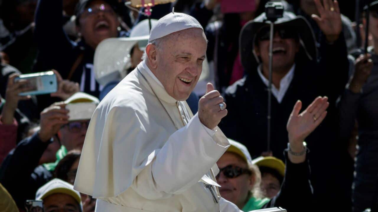 Pope Francis greet the audience during the Weekly General