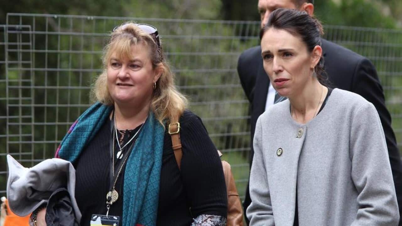 Joanne Ufer and Jacinda Adern chat as they walk to the mine entrance.