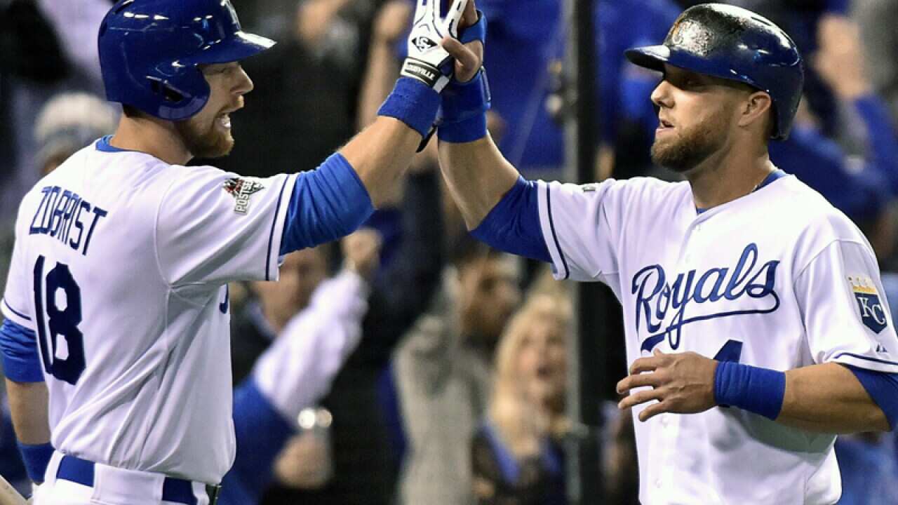 Kansas City Royals' Alex Gordon (R) is congratulated by Ben Zobrist