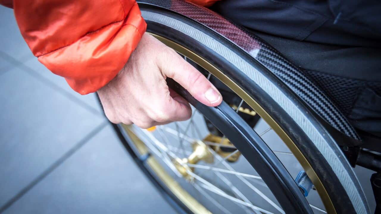 High Angle View Of Man Sitting On Wheelchair