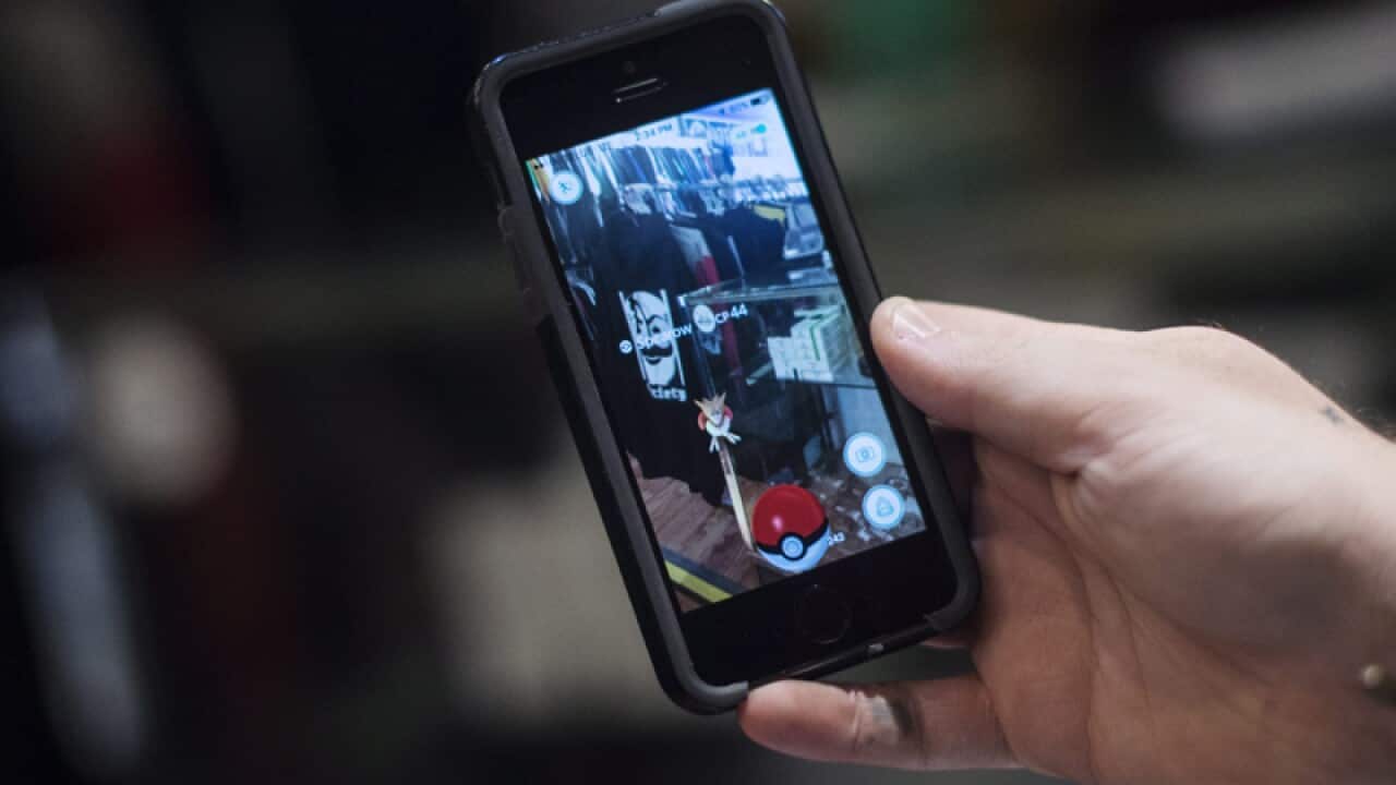 A Pokemon on his phone