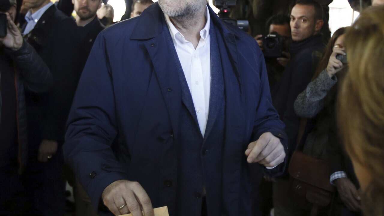 Spanish Prime Minister and leader of the Popular Party (PP), Mariano Rajoy, casts his vote at a polling station in Madrid, Spain, during the Spanish general elections on 20 December 2015.