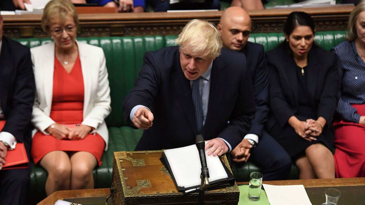 An unrepentant Prime Minister Boris Johnson brushes off cries of 'Resign!' in Parliament (AAP)
