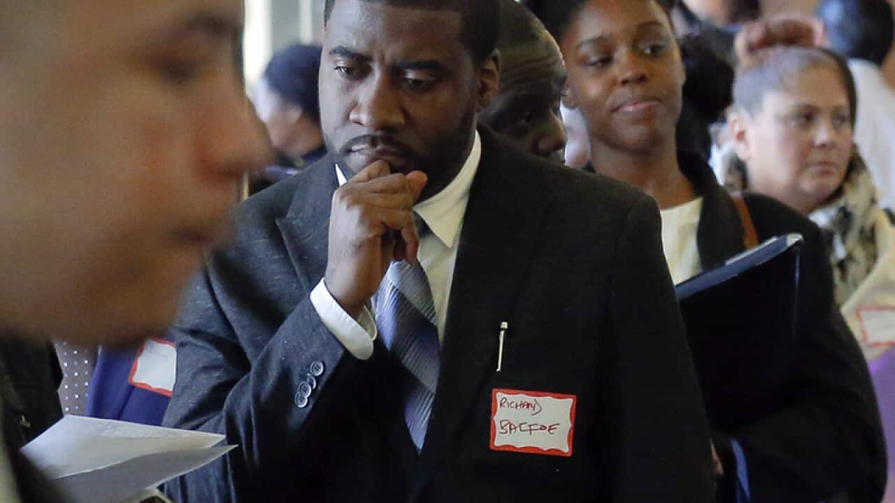 Job seekers attend a job fair in New York