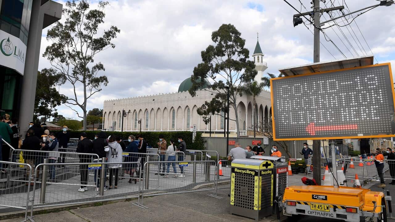 People are seen lining up at a pop-up Covid vaccination clinic at the Lebanes Muslim Association in Lakemba, south west of Sydney, Tuesday, August 10, 2021. More than 80 per cent of the NSW population is now in lockdown as the state struggles to stop the
