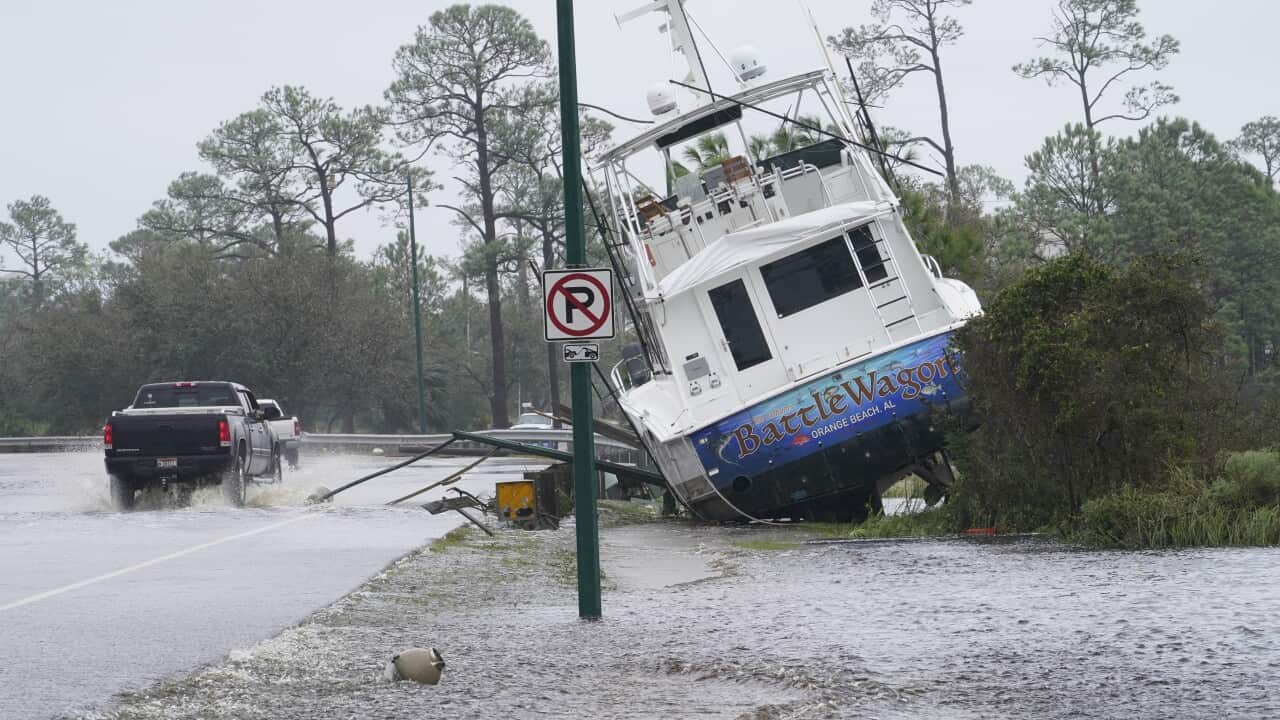 A boat washed up near a road after Hurricane Sally moved through Orange Beach, Alabama.