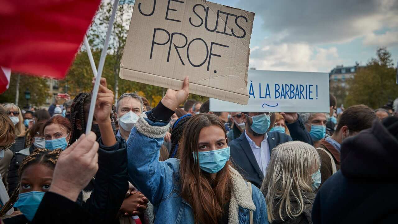 Protesters holding placards during an anti-terrorism vigil at Place de La Republique in Paris.