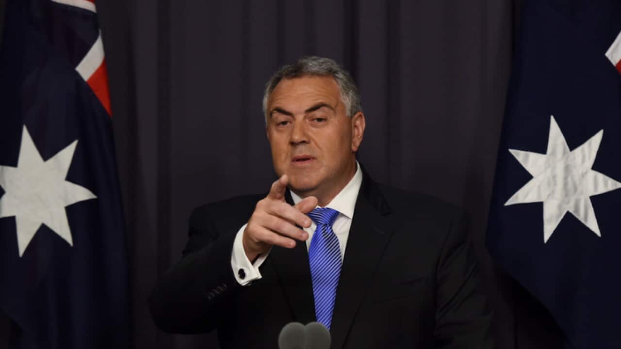 Australian Federal Treasurer Joe Hockey speaks during a press conference at Parliament House in Canberra, Tuesday, July 14, 2015. Hockey says successful debt negotiations with Greece are an encouraging first-step, but there is more to be done.