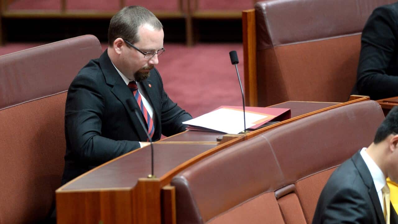 Motorists party senator Ricky Muir during the swearing in of new senators at Parliament House in Canberra, Monday, July 7, 2014. (AAP Image/Alan Porritt) NO ARCHIVING