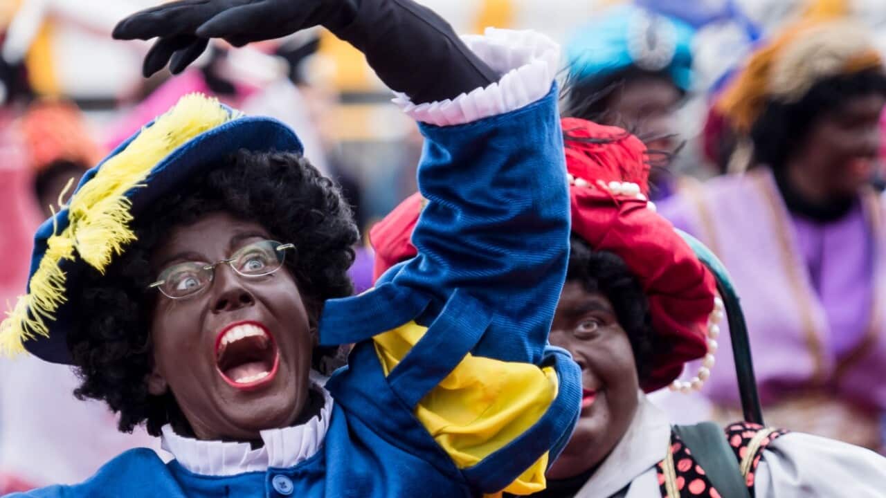 File: Actors dressed as Black Petes arrive on a boat in Antwerp, Belgium