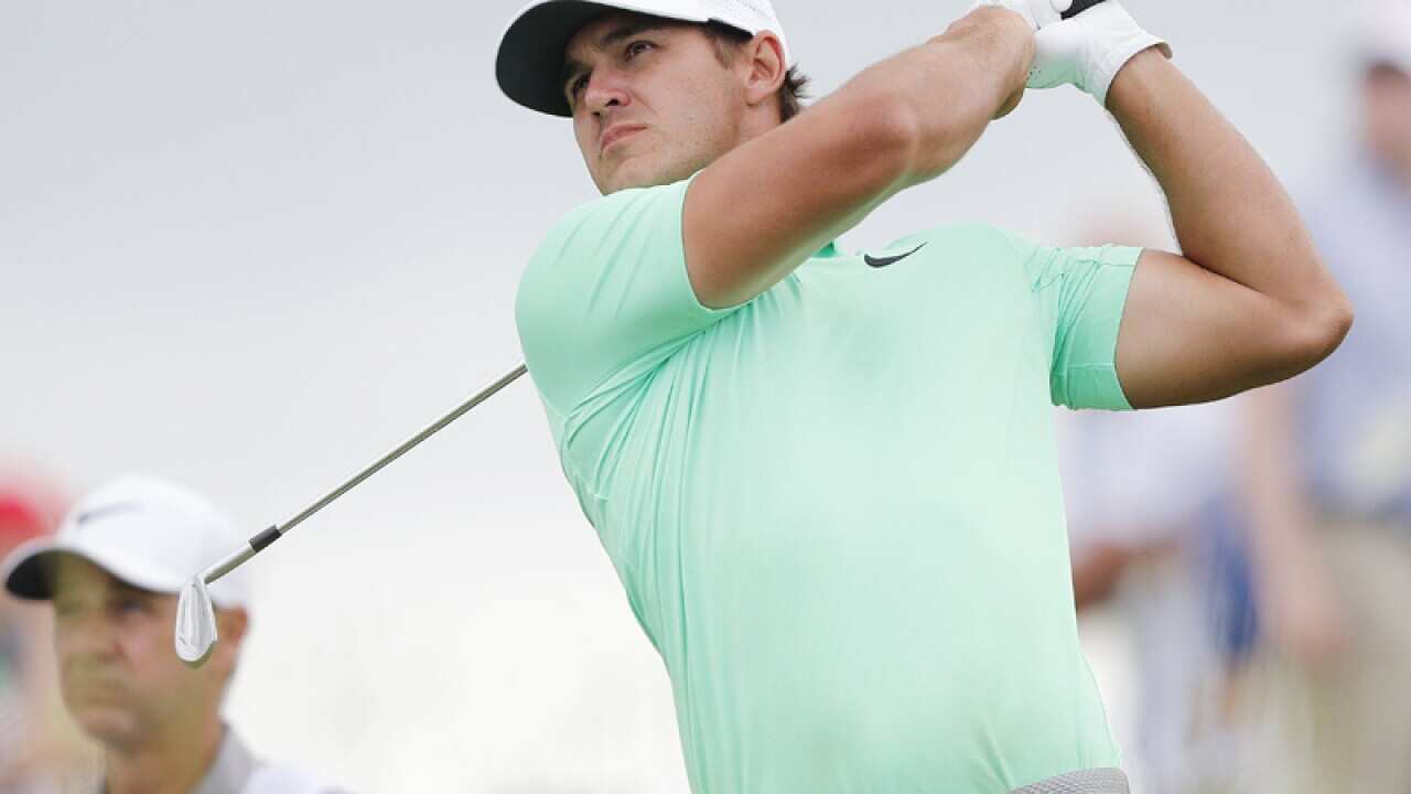 Brooks Koepka hits a tee shot