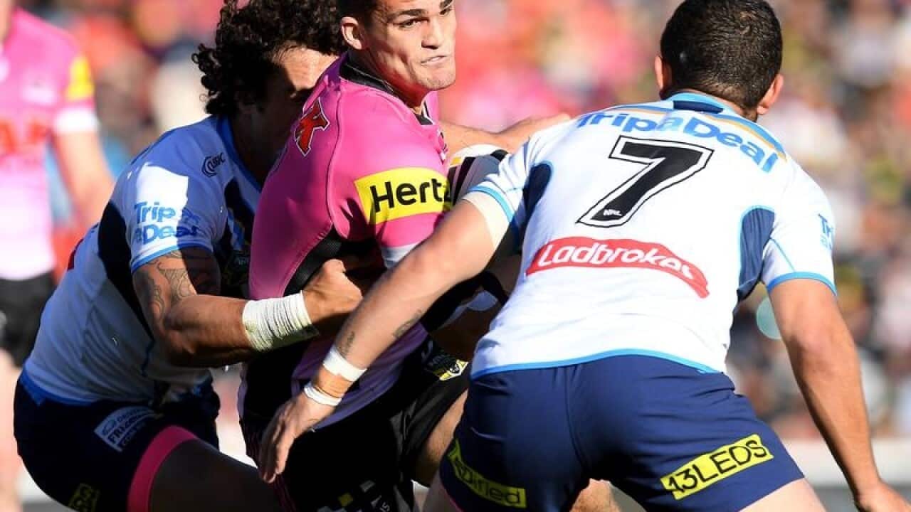 Nathan Cleary of the Panthers is tackled