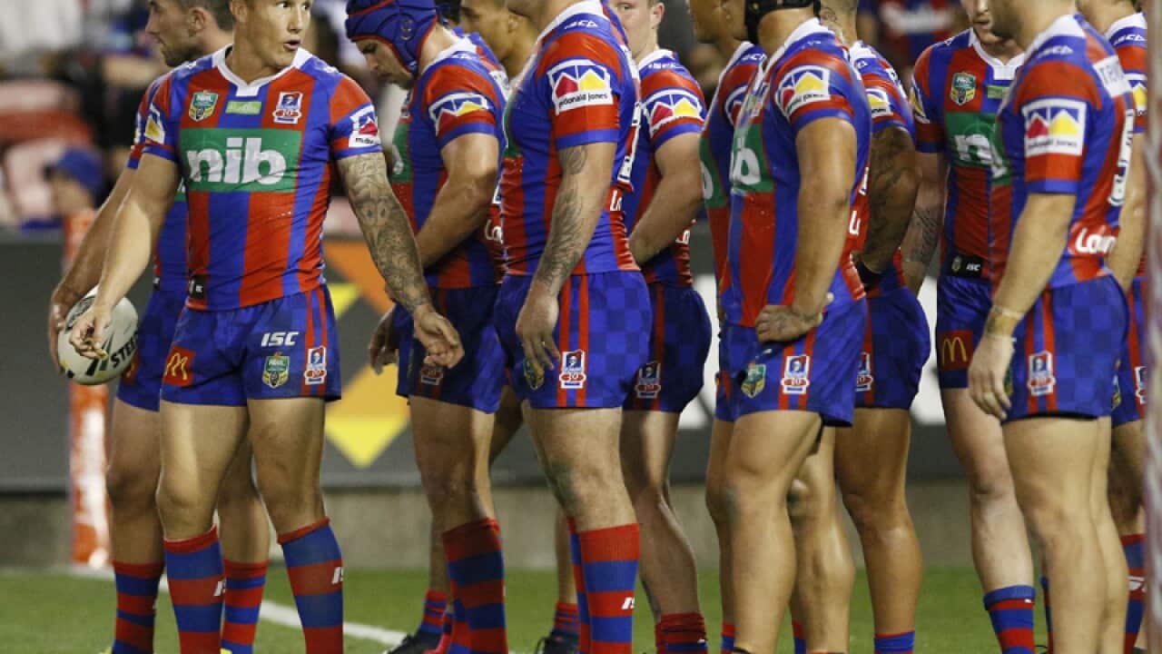 Trent Hodkinson of the Knights gives orders to the team