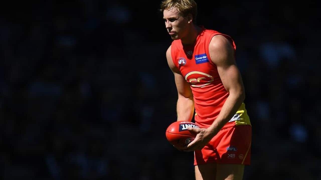 Tom Lynch of the Suns is seen in action