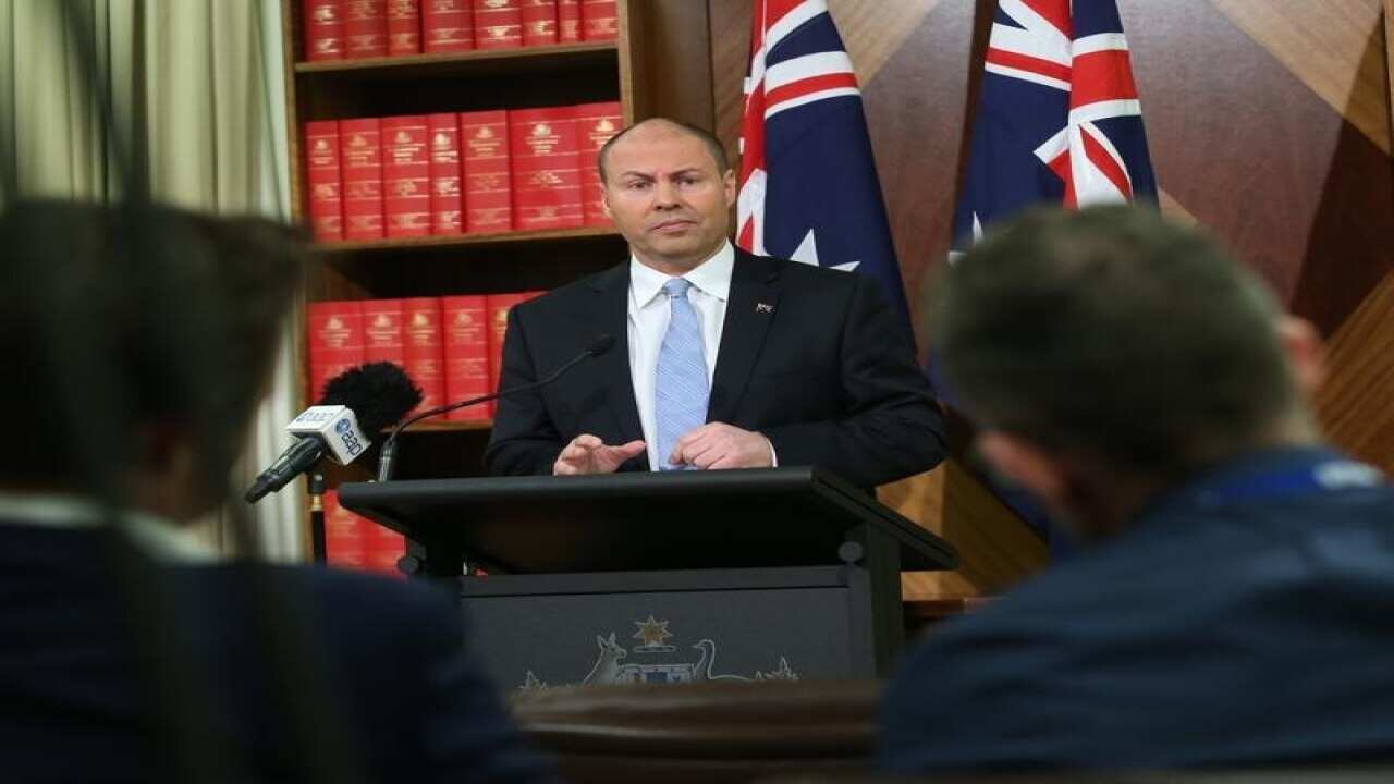 Treasurer Josh Frydenberg speaks to the media in Melbourne.