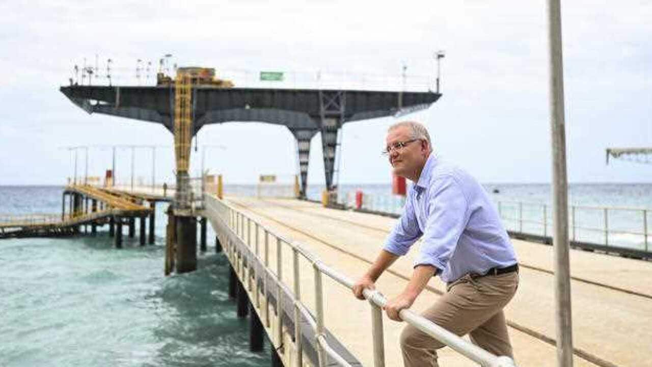 Prime Minister Scott Morrison poses for photographs on Christmas Island.